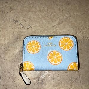 Coach orange print card holder
